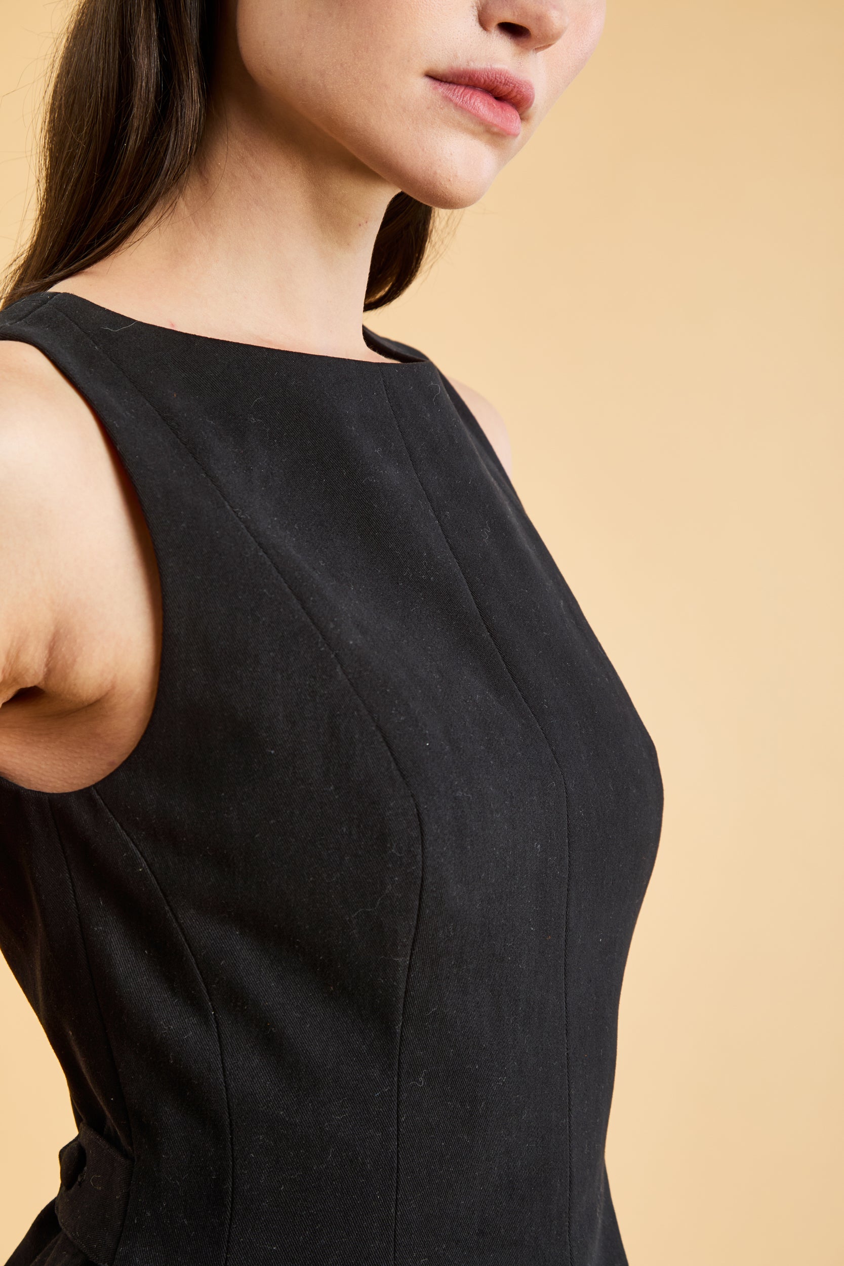 Close up view of the Triplicity Louise Sleeveless Mini Dress to show detail seams