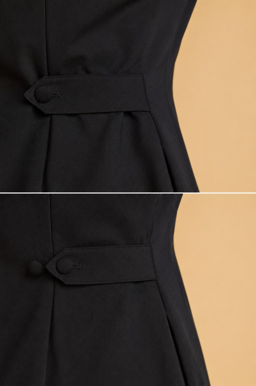 Close-up of a black dress with a button detail on a beige background